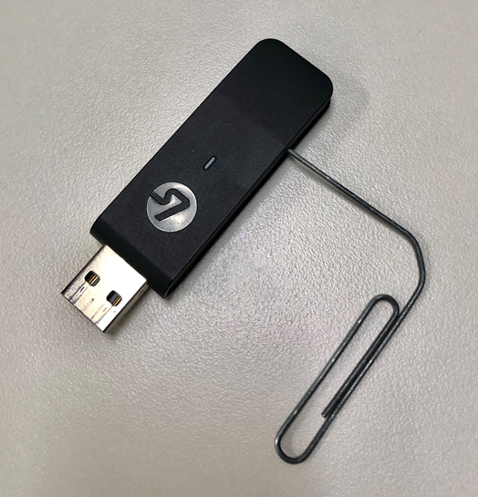 Image showing how to reset the LS50X Dongle using a paperclip