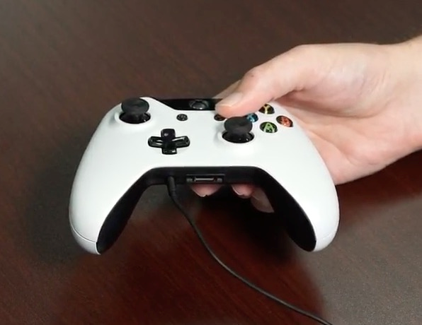 Xbox One controller with 3.5mm cable connected to built in port